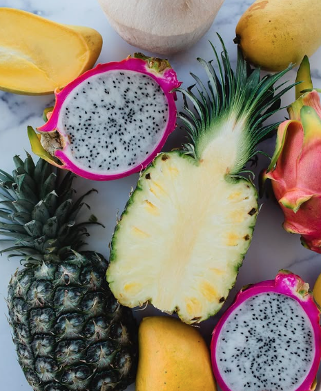 sliced tropical fruit displayed on a table
